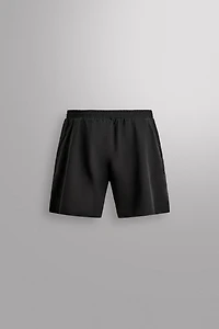 SHORT EN TISSU PERFORÉ 9''