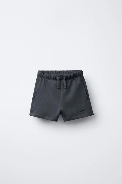 TEXT PLUSH SHORTS