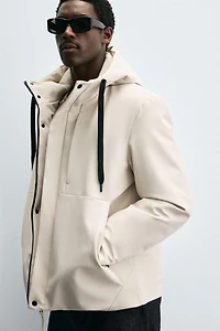 VESTE TECHNIQUE À CAPUCHE