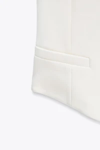 TOP GILET ASYMÉTRIQUE INTERLOCK