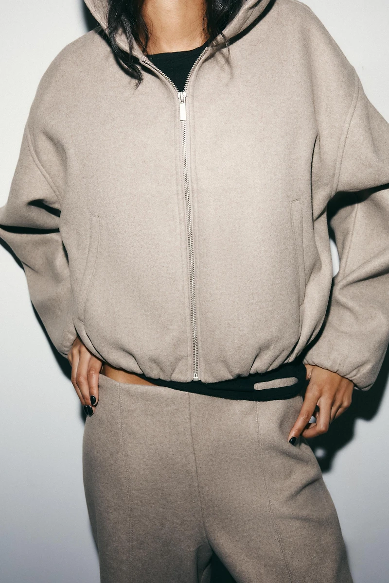 BLOUSON SOFT À CAPUCHE