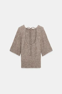 TOP EN MAILLE DOS NU