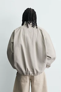 ZIPPERED POUCH POCKET SWEATSHIRT