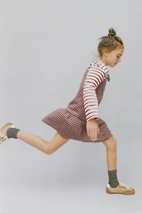 ROBE-SALOPETTE À CARREAUX ET NŒUDS