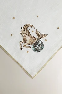 EMBROIDERED LINEN CAPRICORN NAPKIN | MARISA BERENSON