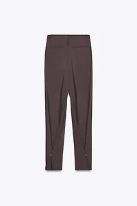 PLEATED PANTS WITH BUTTON HEM