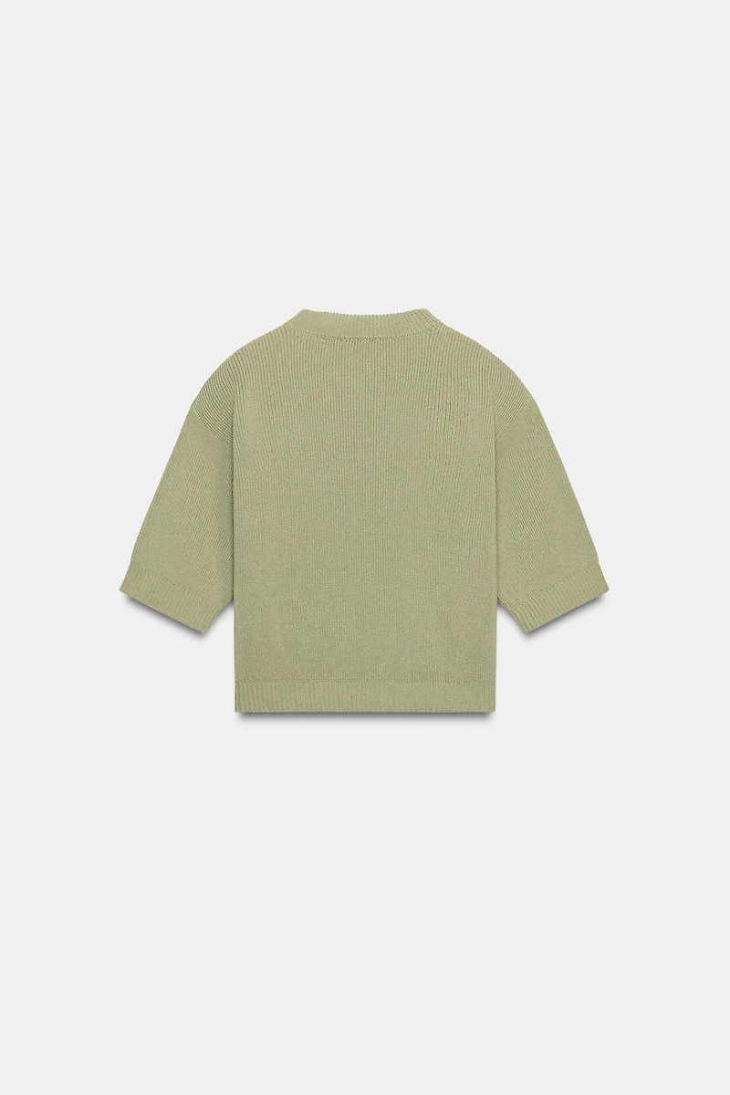 PULL EN MAILLE AVEC ÉPAULETTES