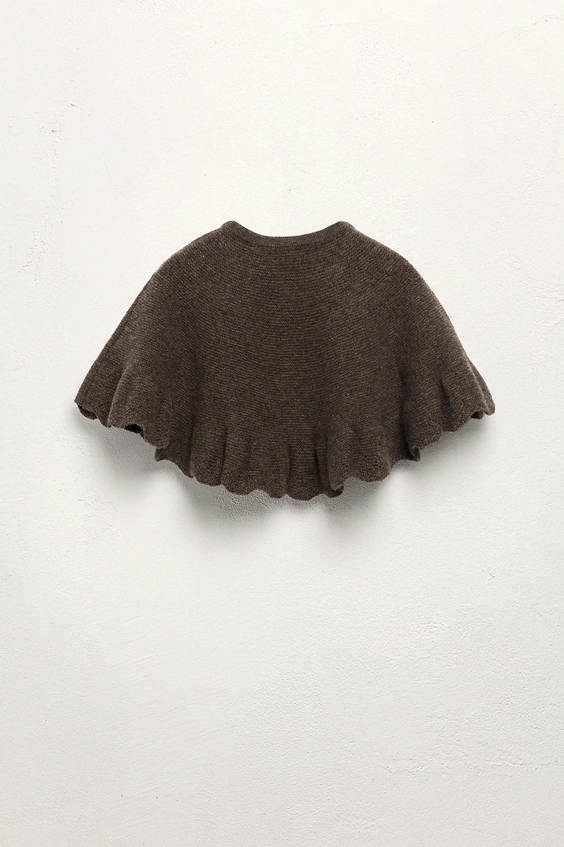 100% WOOL RUFFLED KNIT CAPE LIMITED EDITION