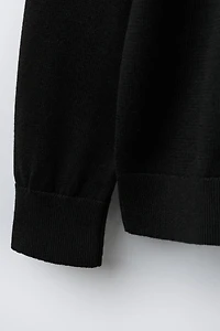 PULL EN MAILLE À COL ROULÉ