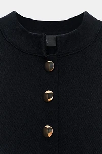 GOLD BUTTON PEPLUM CARDIGAN