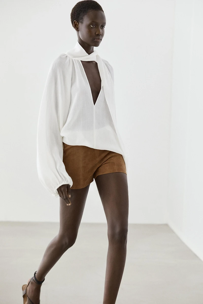 Flowing V-neck blouse with tie