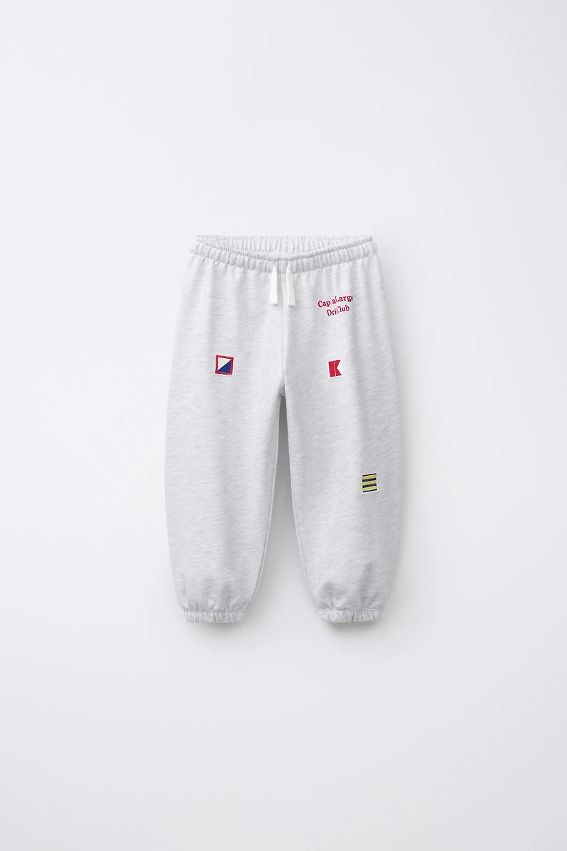 EMBROIDERED FLAG JOGGER PANTS