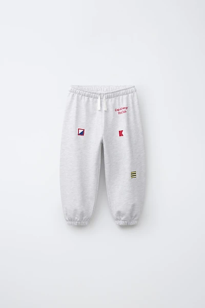 EMBROIDERED FLAG JOGGER PANTS