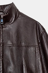 BOMBER COURTE MATIÈRE SYNTHÉTIQUE