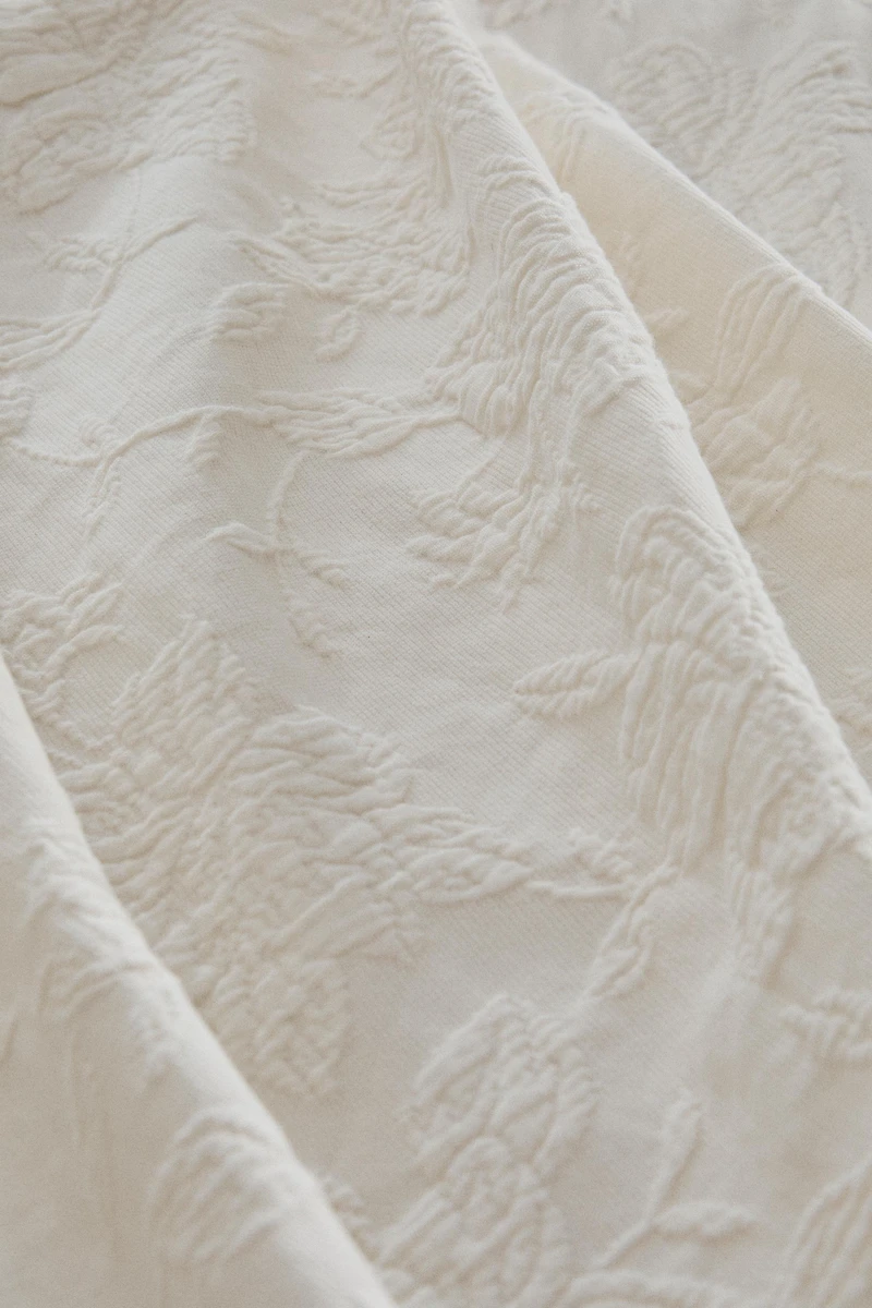 JACQUARD BEDSPREAD WITH RUFFLES