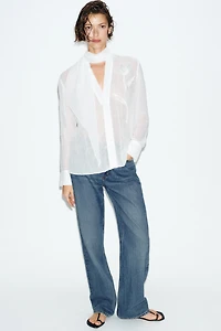 BLOUSE SEMI-TRANSPARENTE FLEUR