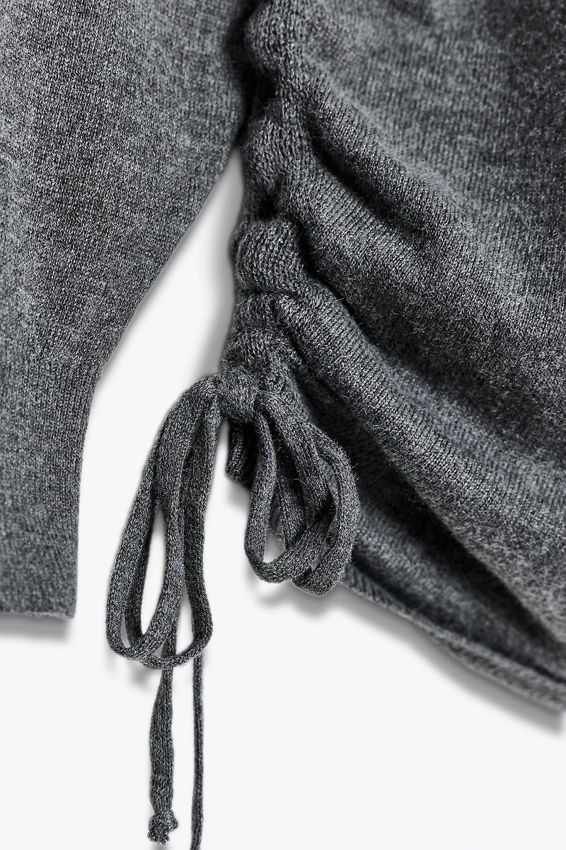 TIE KNIT SWEATER