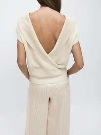Knit sweater with low-cut back