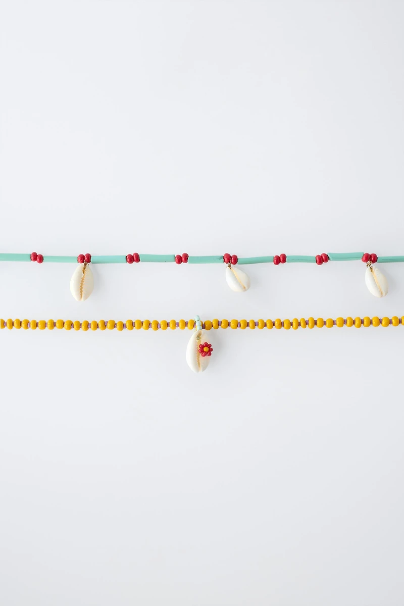 PACK OF TWO BEADED SHELL NECKLACES