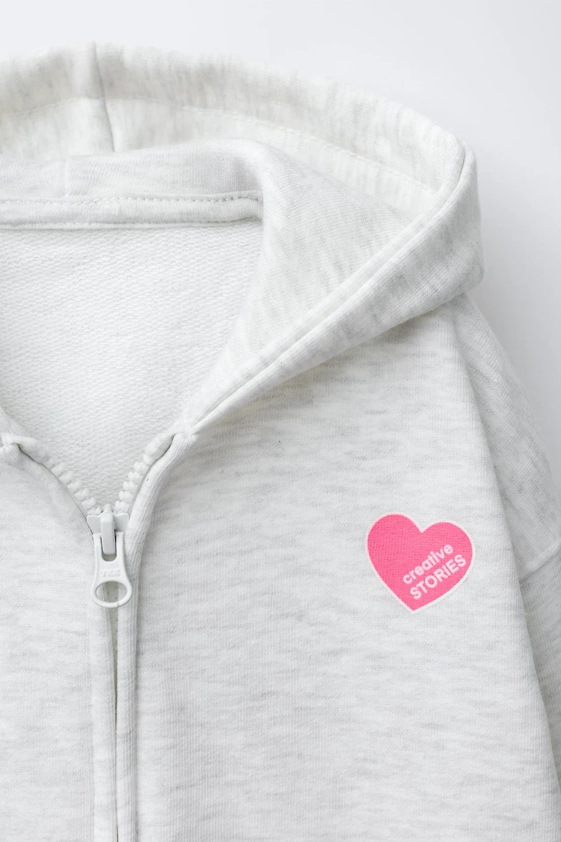 SWEAT ZIPPÉ IMPRIMÉ CŒUR