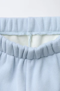 FLEECE LINED BAGGY PANTS WITH LOGO