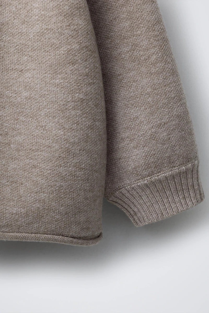 BUTTON KNIT SWEATER
