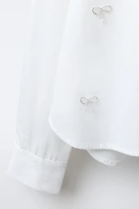 CROPPED SHIRT WITH JEWEL BOWS