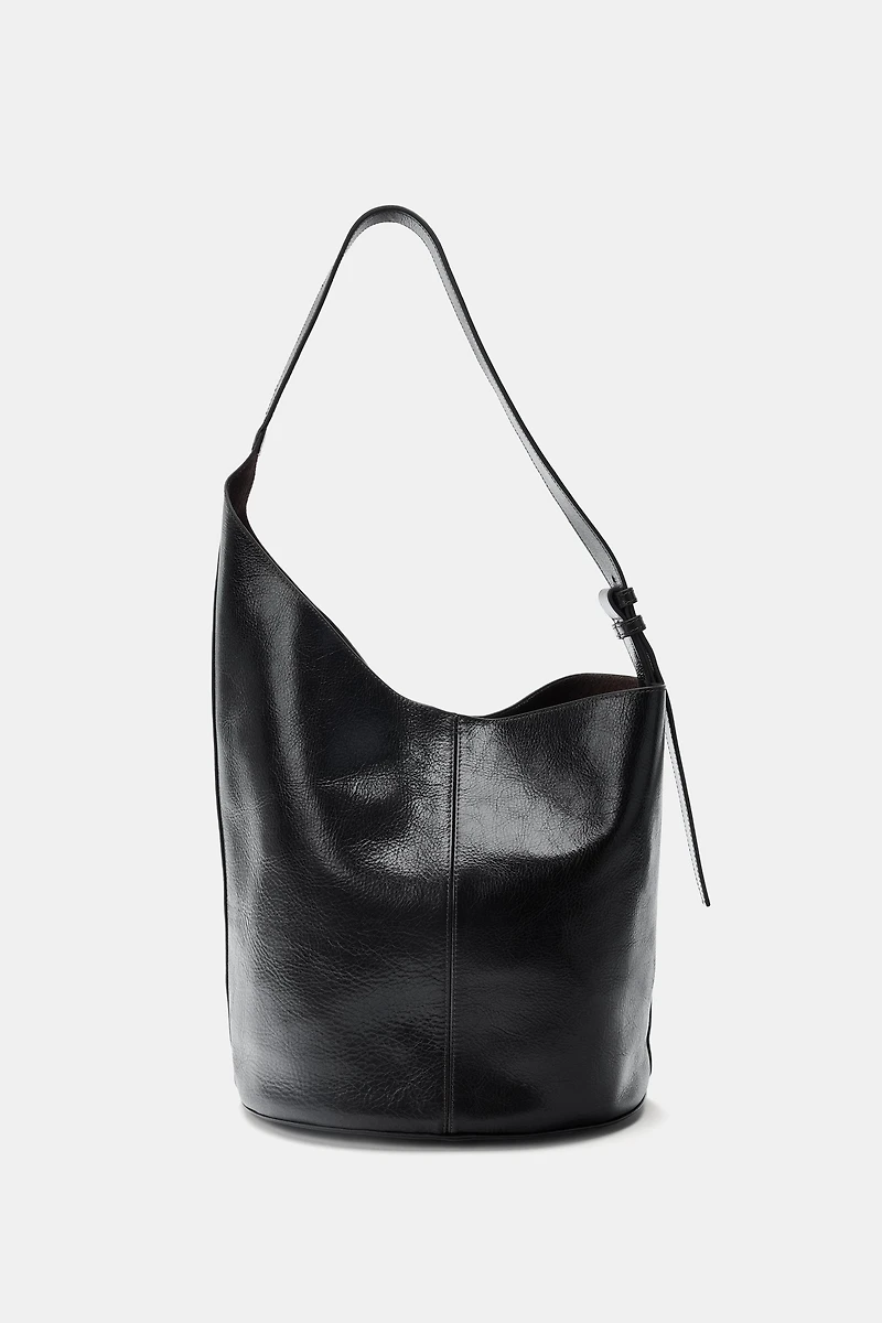 ASYMMETRIC LEATHER BUCKET BAG