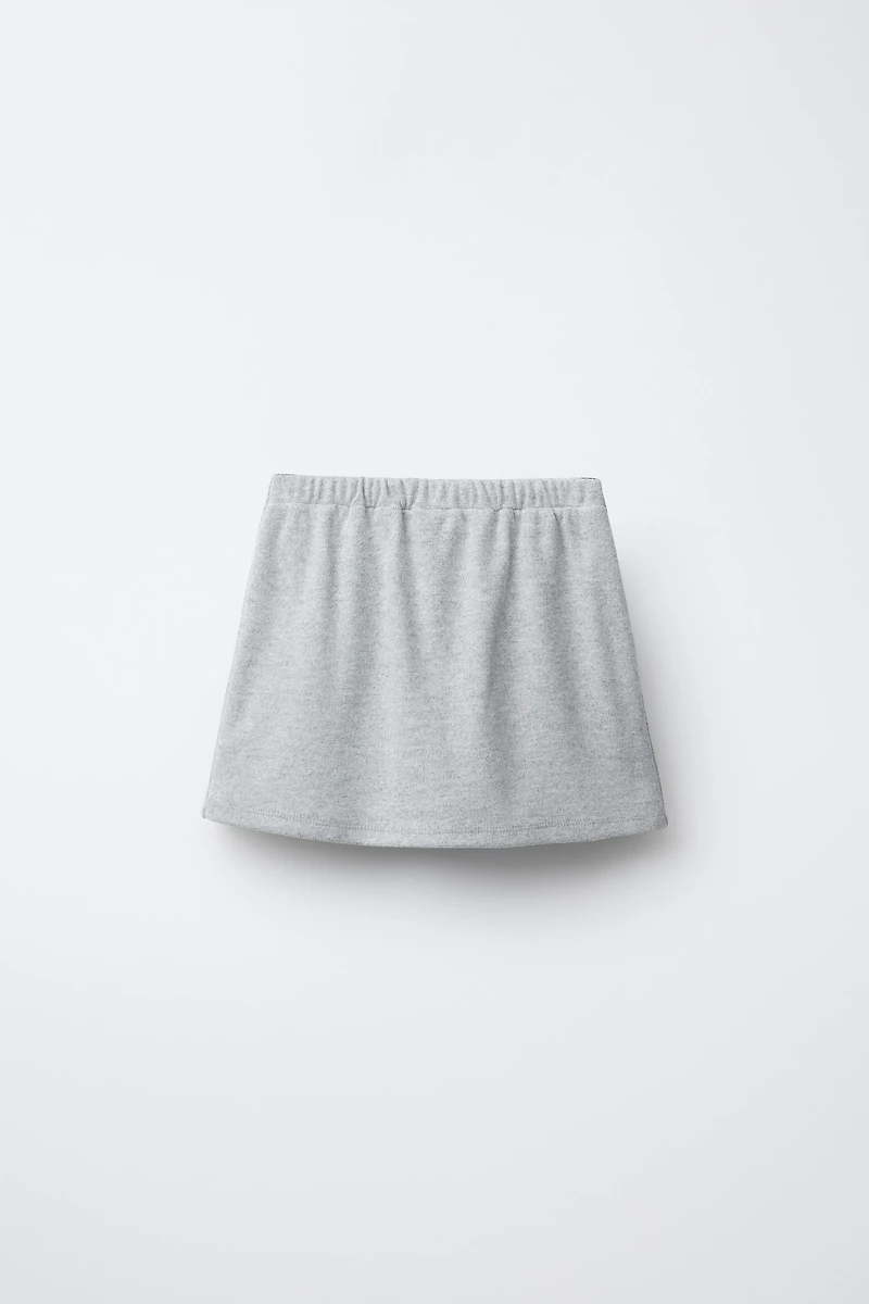 JUPE-SHORT DOUX AU TOUCHER AVEC NŒUD