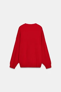 PULL EN MAILLE AVEC DÉCOLLETÉ PRONONCÉ