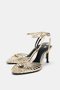 METALLIC KNOTTED HEELED SANDALS