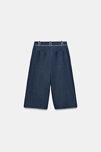 SHORT LARGE À LISERÉS EN CONTRASTE