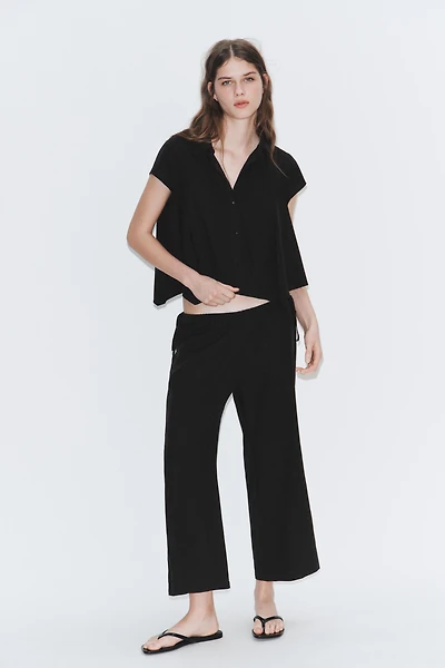 TIED ANKLE-LENGTH FLOWY PANTS