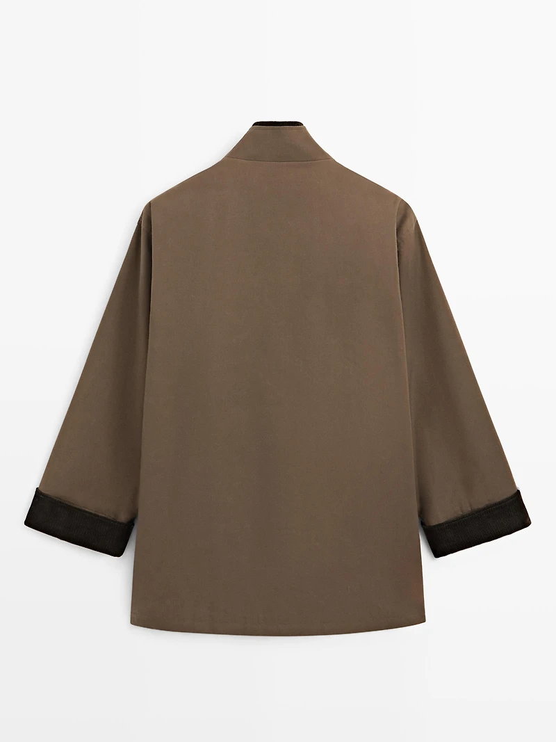 Waxed high neck parka with corduroy detail