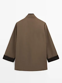 Waxed high neck parka with corduroy detail
