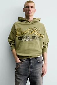 WASHED PRINTED TEXT SWEATSHIRT