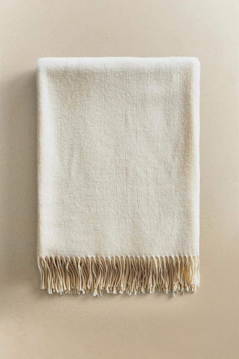 DECORATIVE FRINGED BLANKET
