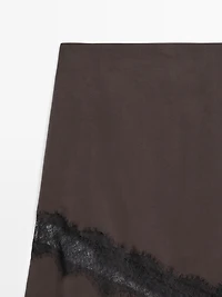 Flowing asymmetric midi skirt with lace detail