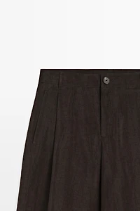 Wide-leg flowing trousers with darts