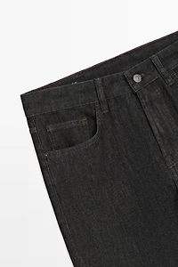 Lightweight tapered fit desized jeans