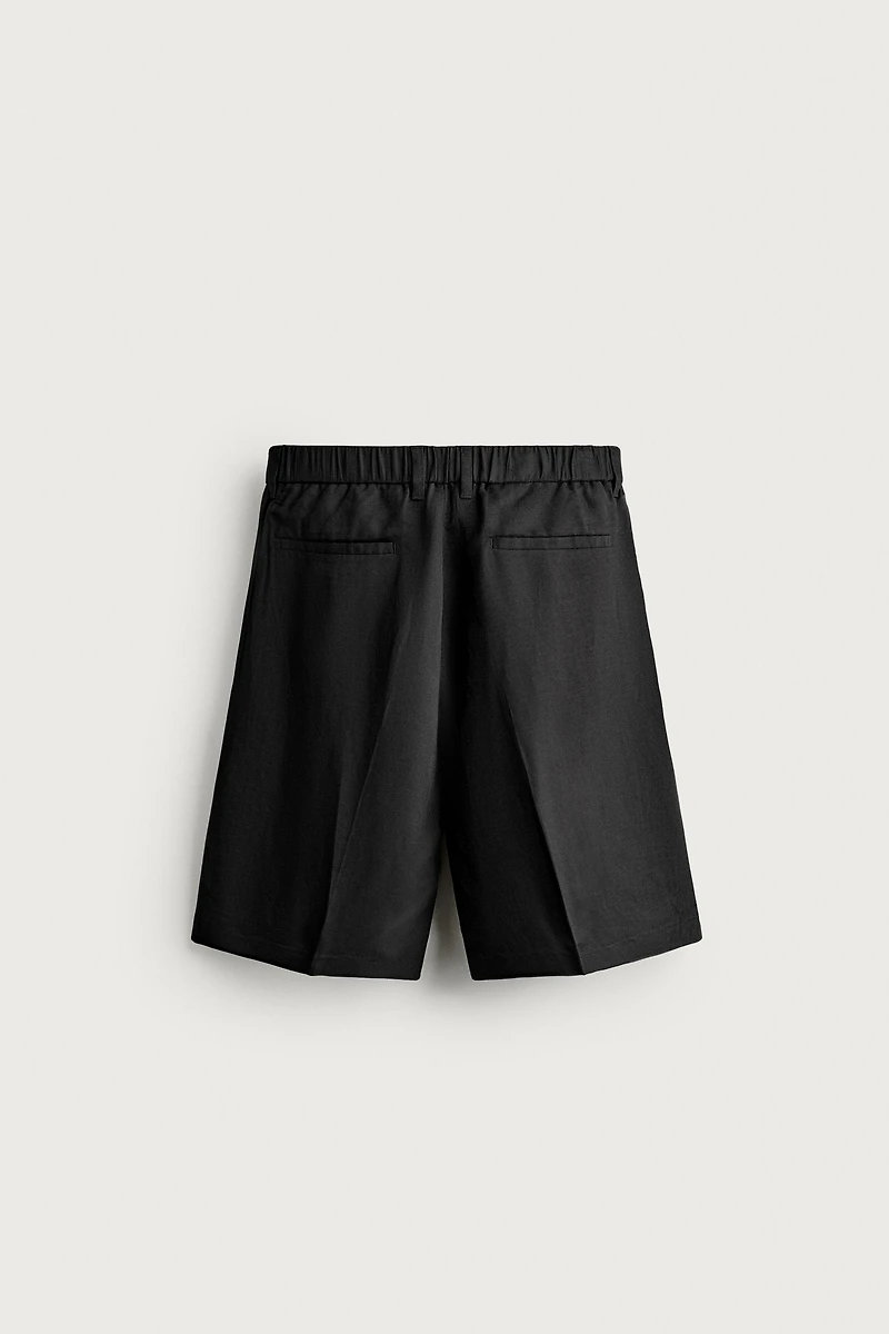 TEXTURED PLEATED SUIT SHORTS