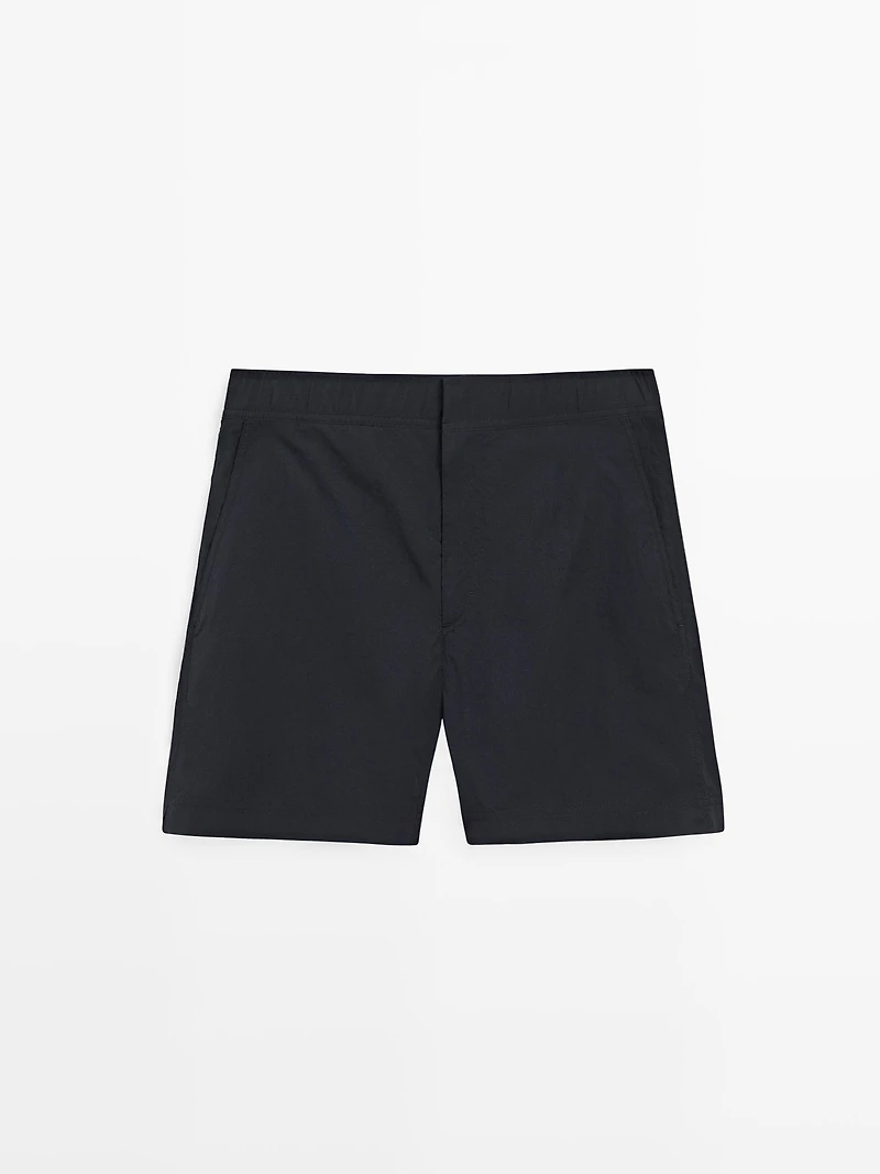 Plain swimming trunks with waist detail