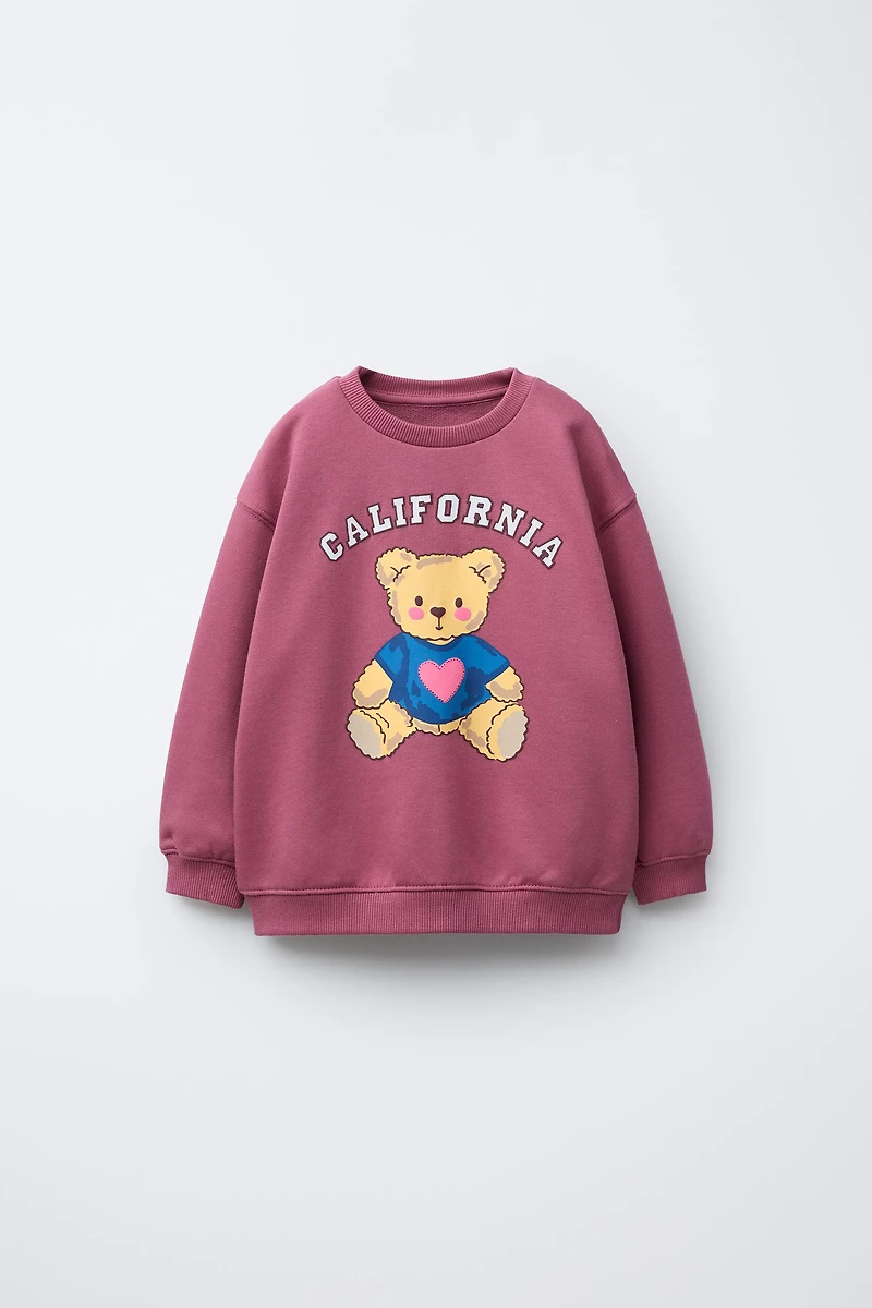 RAISED PRINT SWEATSHIRT