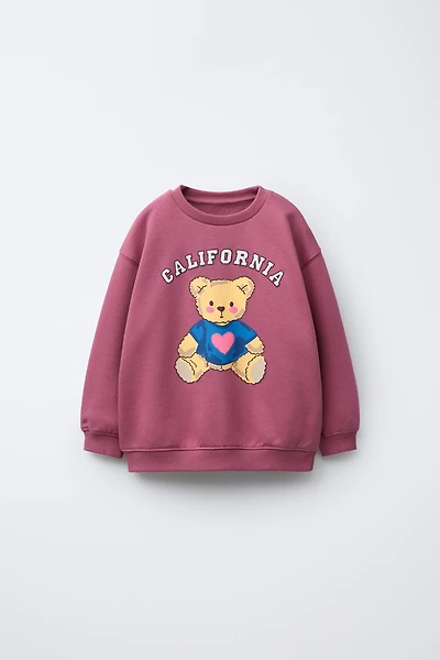 RAISED PRINT SWEATSHIRT