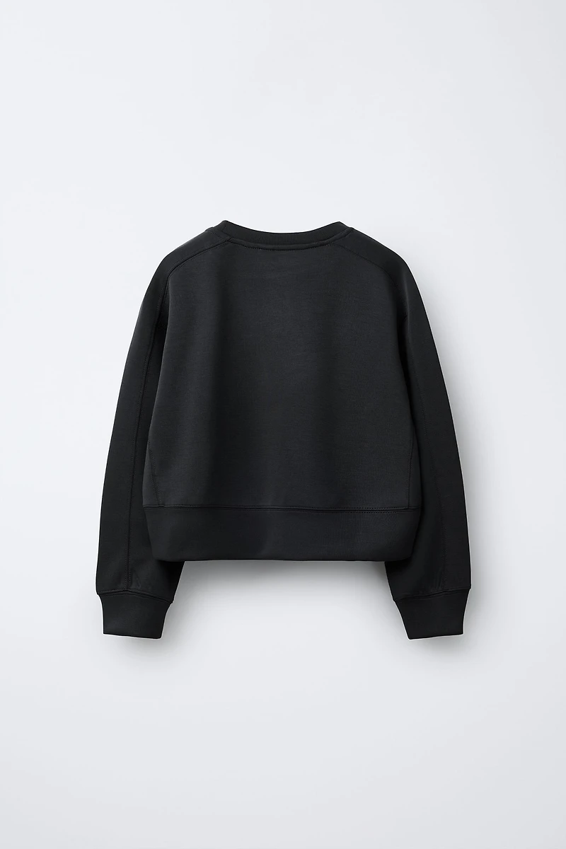 RAISED TEXT SWEATSHIRT