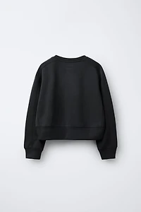 RAISED TEXT SWEATSHIRT