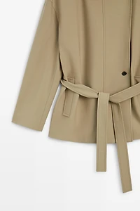 Mid-length belted trench coat