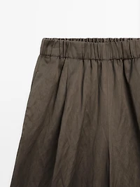 Wide-leg satin trousers with creased effect