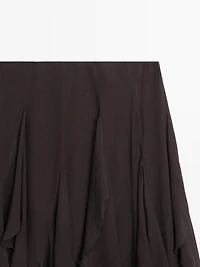 Asymmetric skirt with ruffles