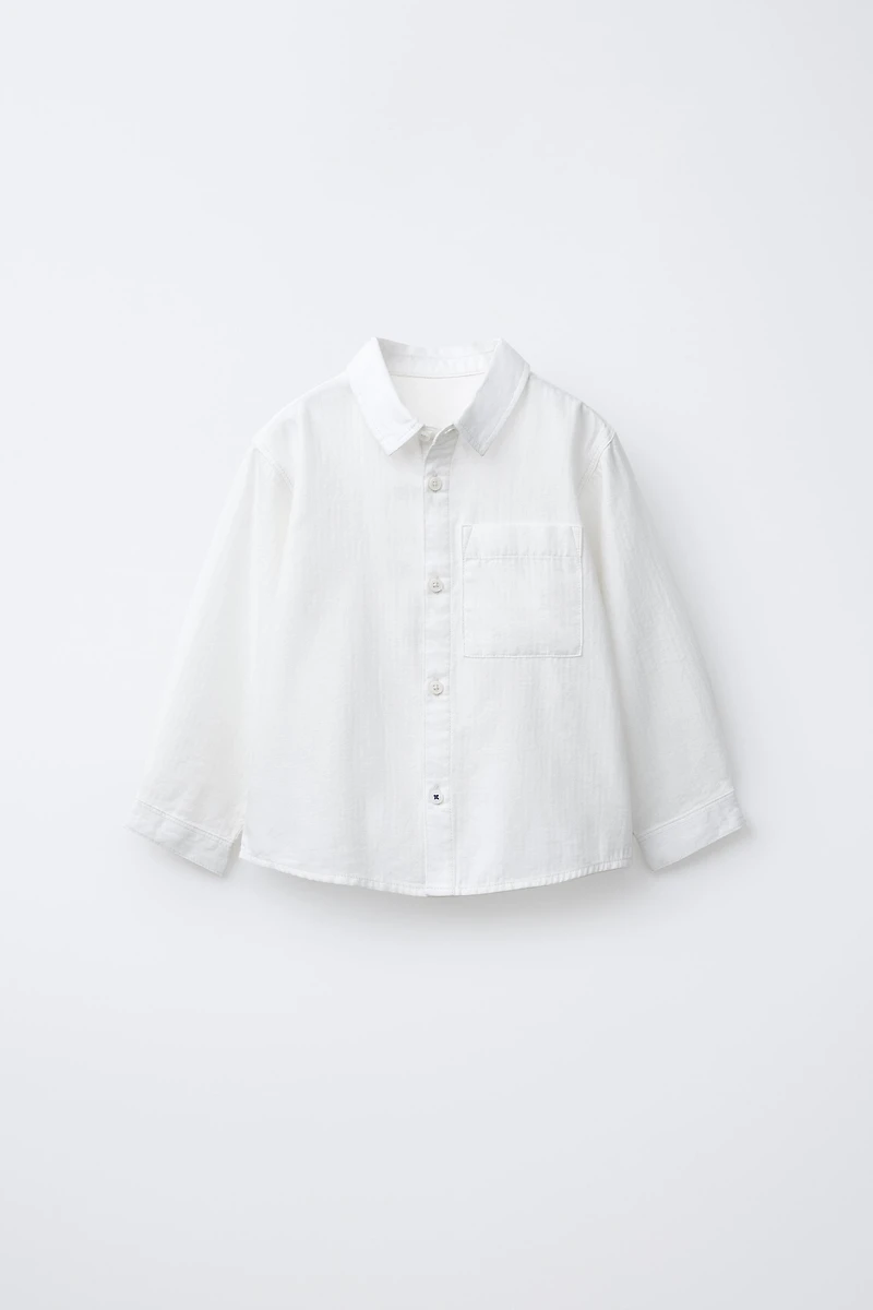 CHEMISE UNIE À POCHE